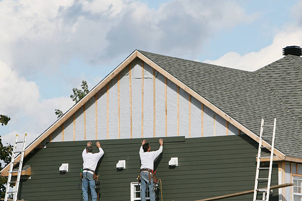 Professional Siding technician working in Manor, TX